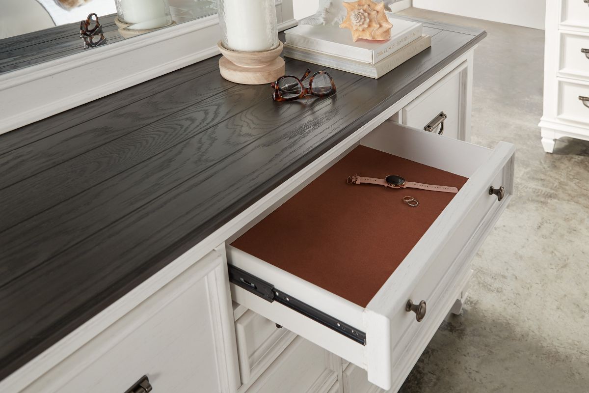 The top front of the Higgins Dresser showing an open drawer is lined with felt