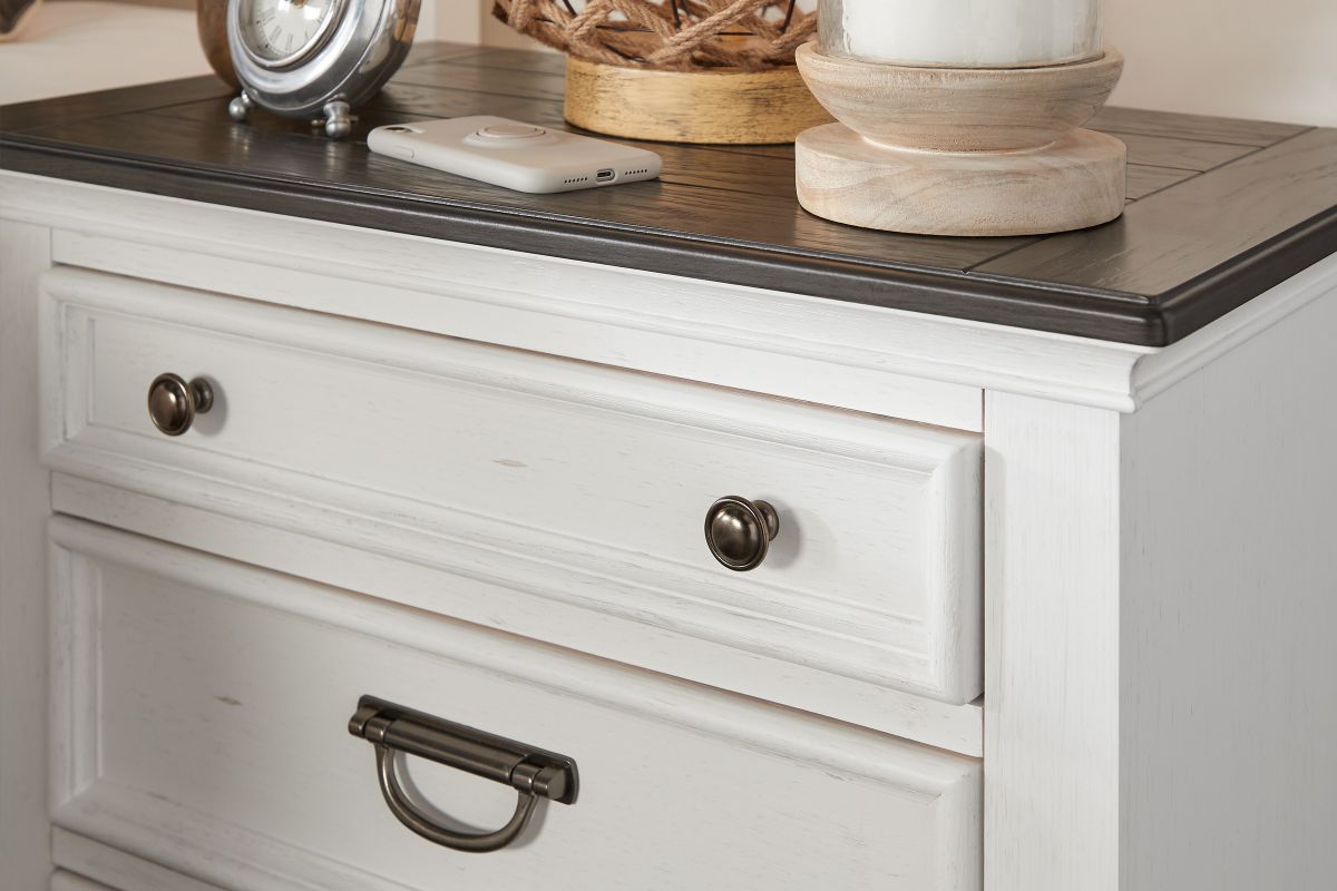 The front of the Higgins Nightstand with white and dark brown wood.