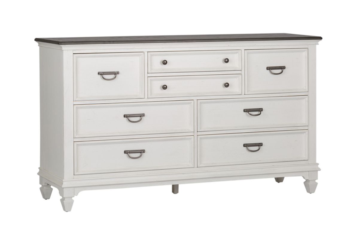 Corner view of a white wood dresser with 8 drawers