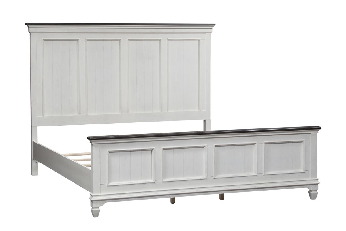 Corner view of a white wood king size bed without a mattress