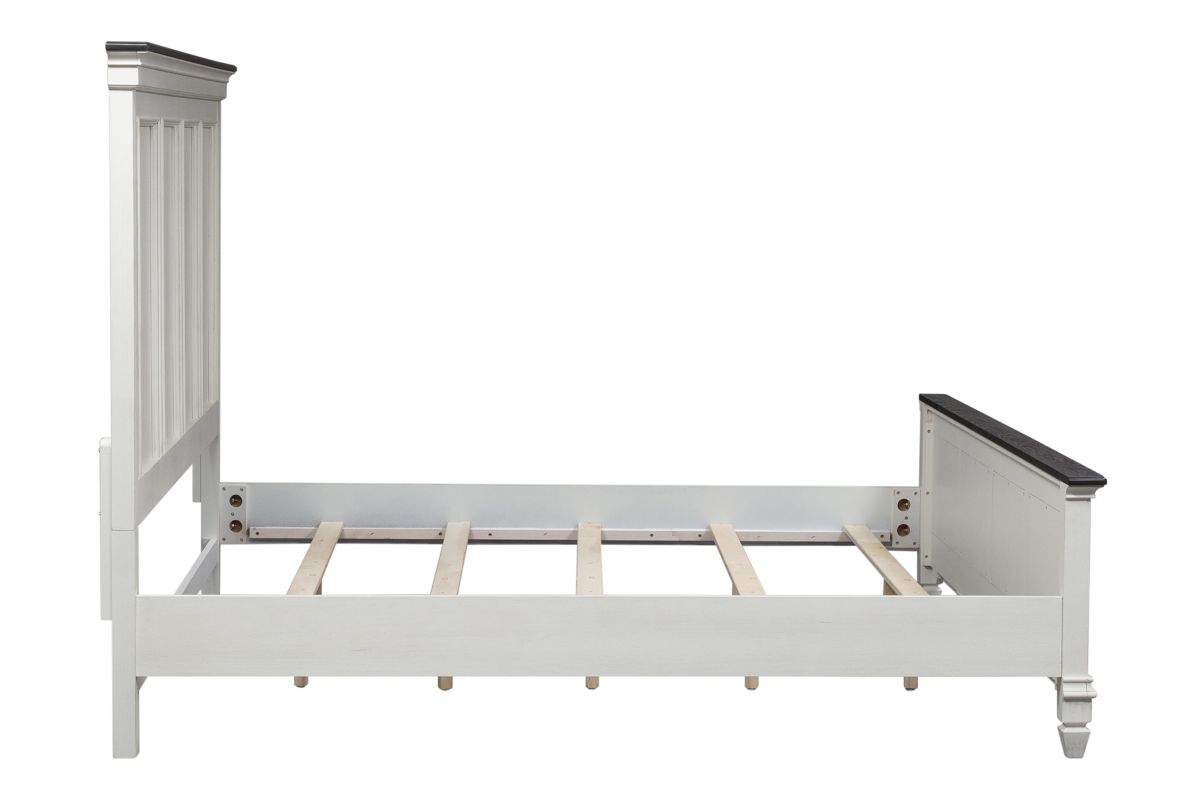 Side view of a white wood king size bed without a mattress