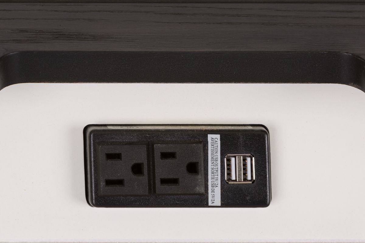 A standard three prong plus with two spots and two USB ports.