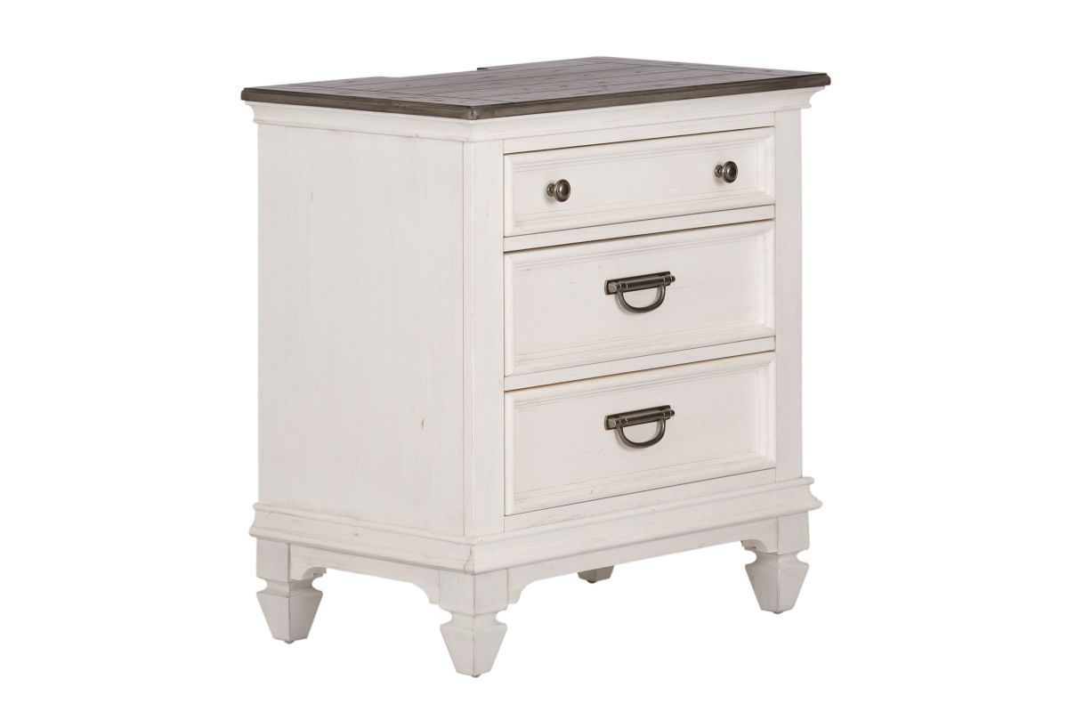 Corner view of a white wood 3-drawer nightstand